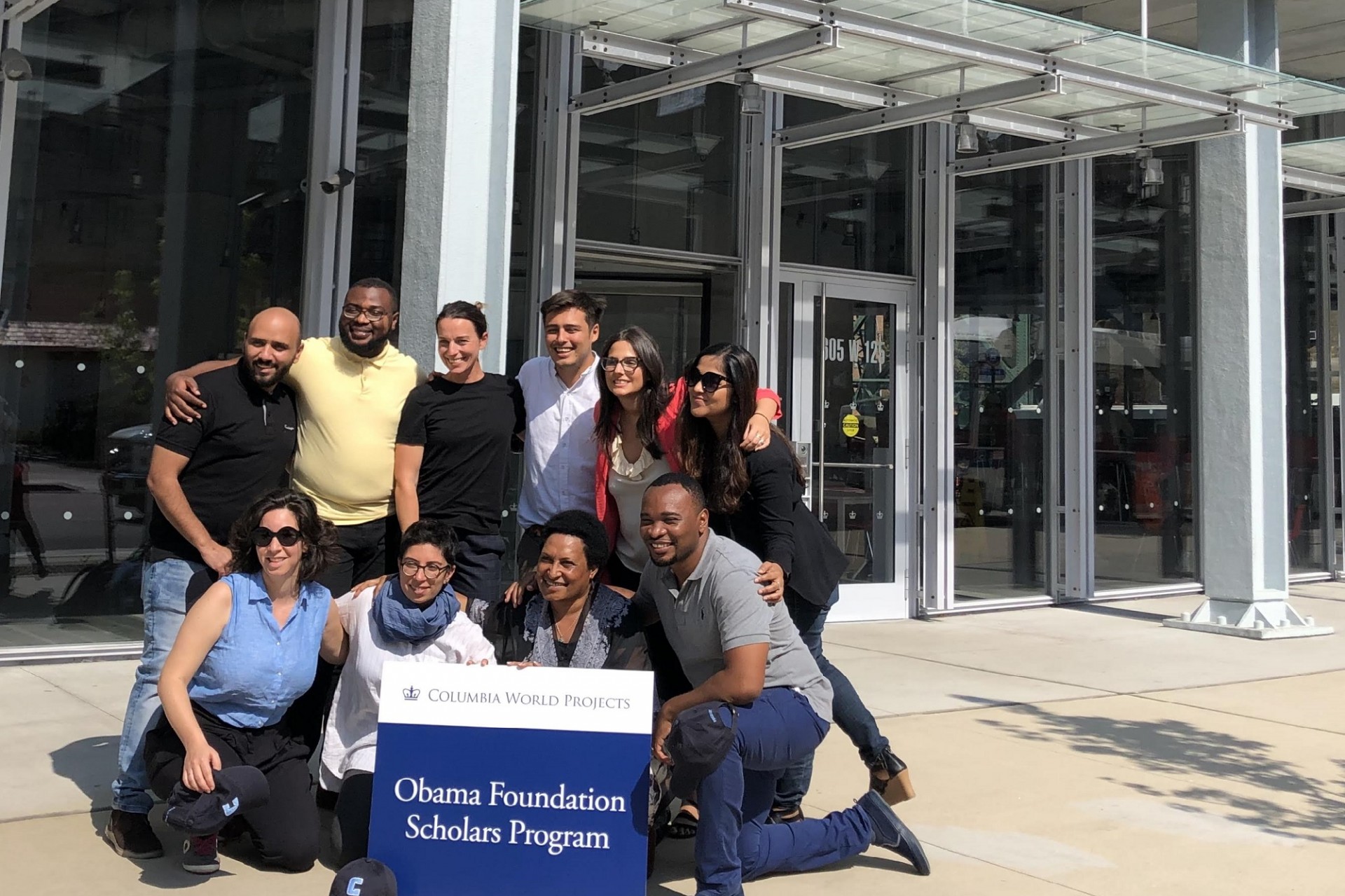Obama Foundation Scholars pose in front of the Bollinger Forum building