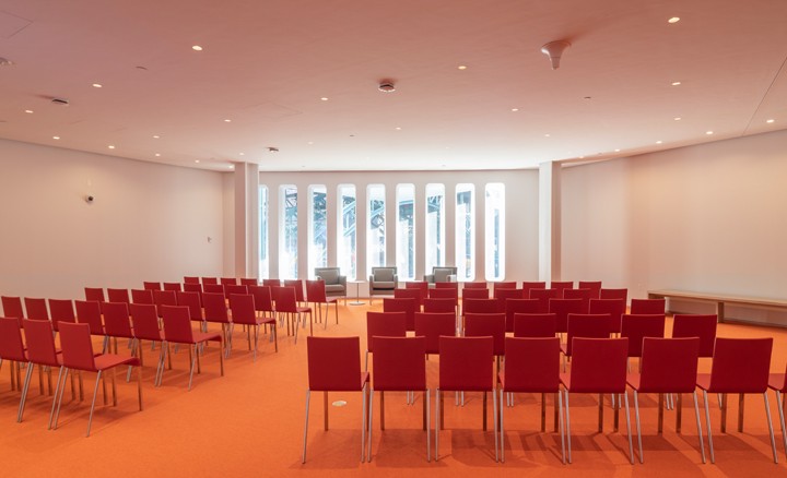Foyer room with chairs facing the windows in theatre style formation 