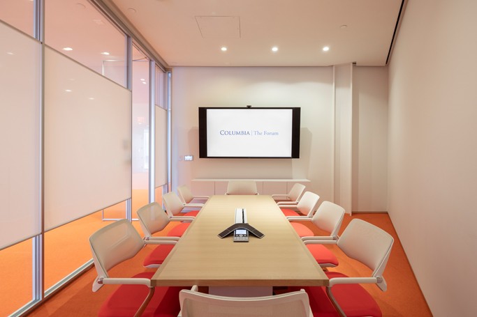 Meeting room 317 features a large conference table with ten chairs 