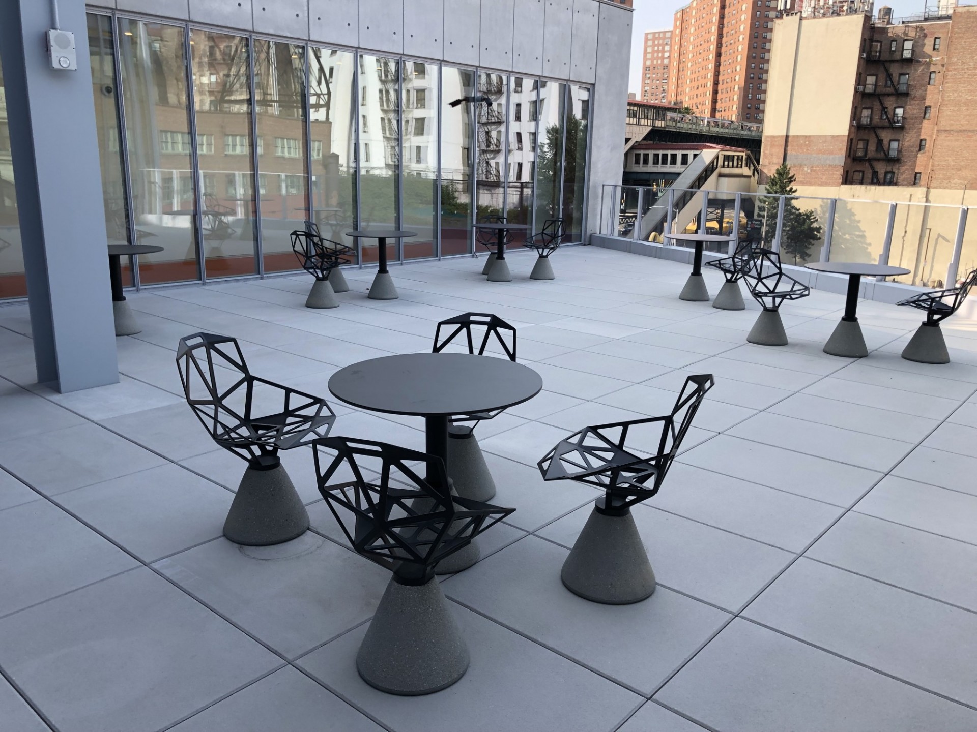Terrace with weather proof tables and chairs in café style formation 