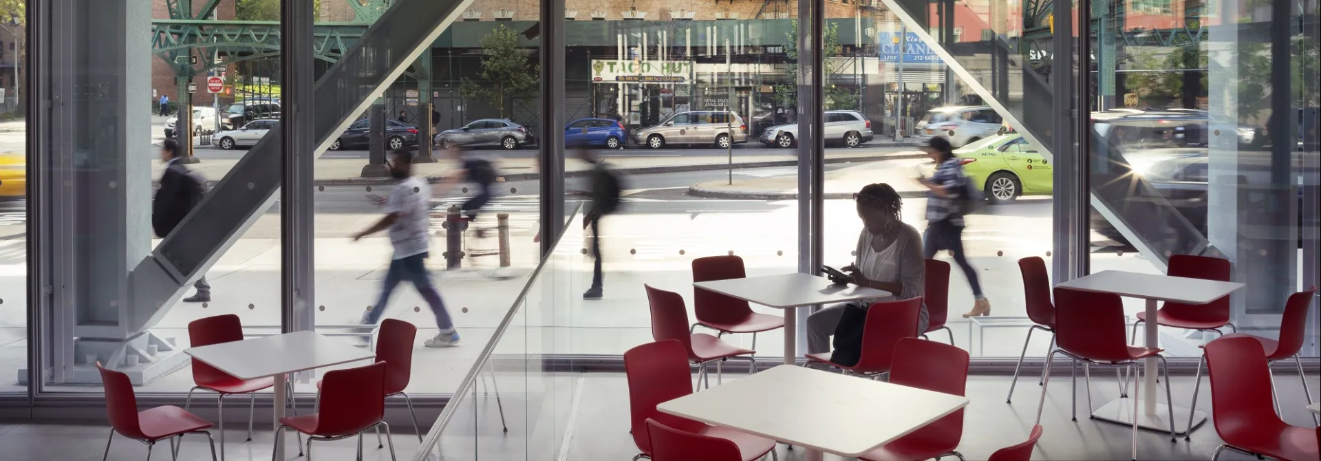 View from inside the Forum's atrium looking out the glass walled windows onto Broadway
