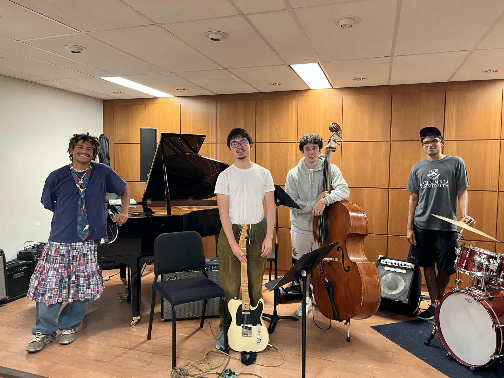 Students from the Louis Armstrong Jazz Performance Program pose with instruments