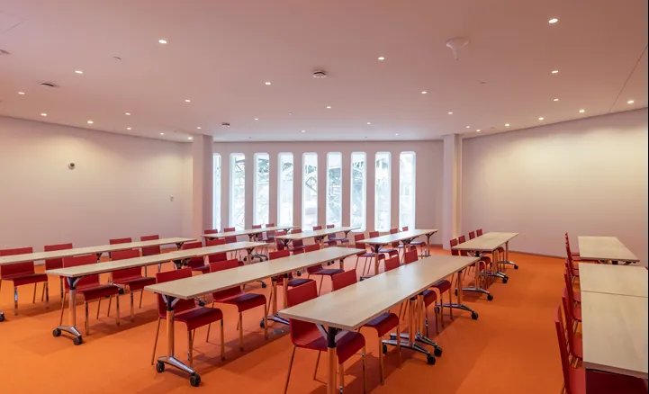 The Forum's foyer with tables setup classroom style