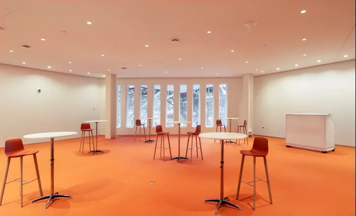 The Forum's Foyer room with hightop tables and highchairs setup in a reception-style with bar