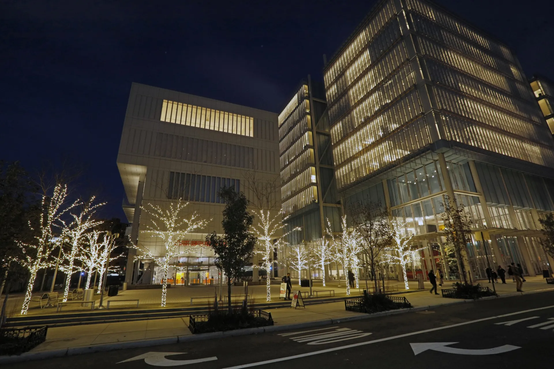 View of Lenfest Center for The Arts and the plaza in front of it, with trees alit