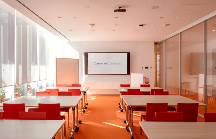 Room 301 setup with tables and chairs in workshop style