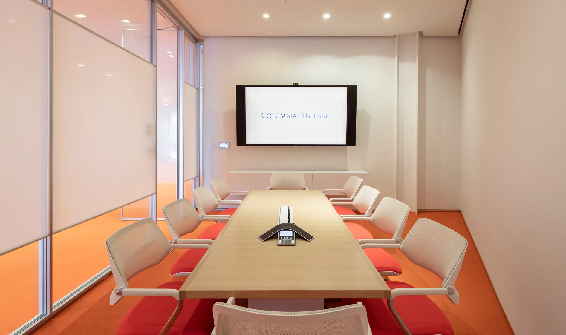 View of The Forum's room 317 conference room with table surrounded by ten chairs