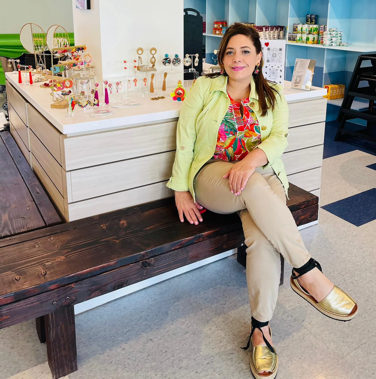Raysa Veras poses with her creations at Rouge Hoops